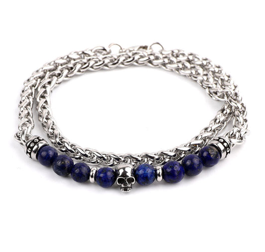 P10345C PULSERA LARGA DE ACERO INOX. CON PIEDRAS AZULES Y CALAVERA.