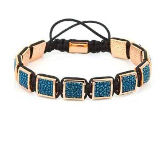 P94173 PULSERA DE CUENCAS CUADRAS DE îNIX COLOR GOLDEN Y TURQUESA.